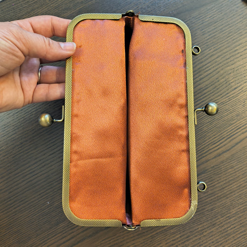 Kiss Clasp Clutch